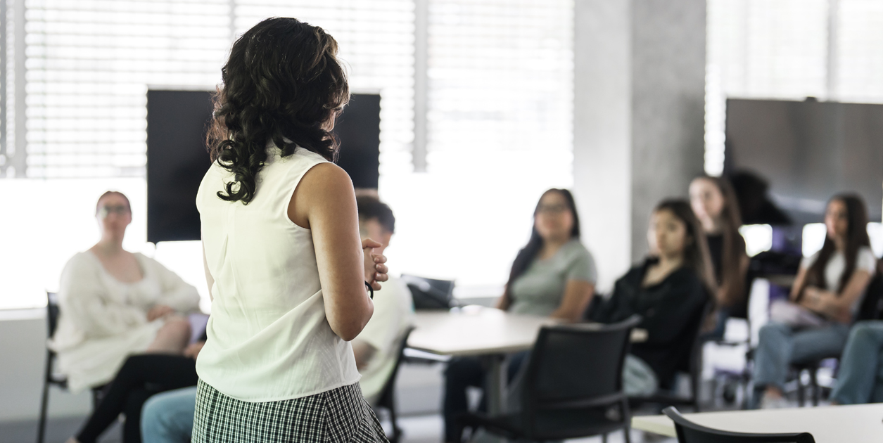 An ACU lecturer standing in front of a class