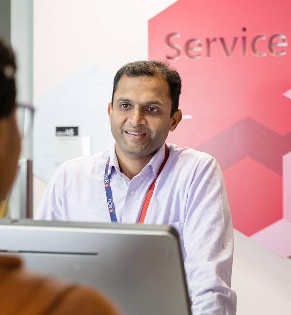 Staff member behind counter