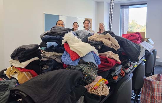 Layers for Lent donation sorting in Melbourne with Jeremy Ambrose Josh Beard Lisa Carzino and Eleanor Duggan