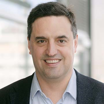  Associate Professor Michael Campion a white man wearing pale blue shirt and blazer