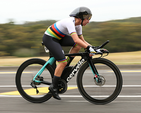  Female cyclist on a black and pale blue racing bike