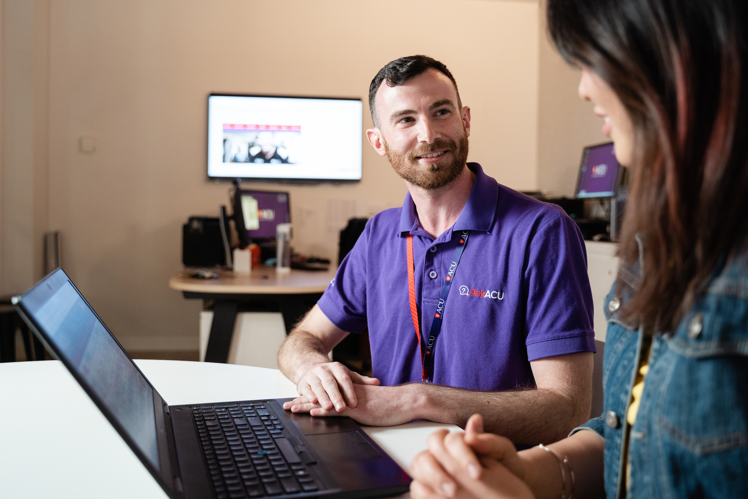 ACU representative assisting a student