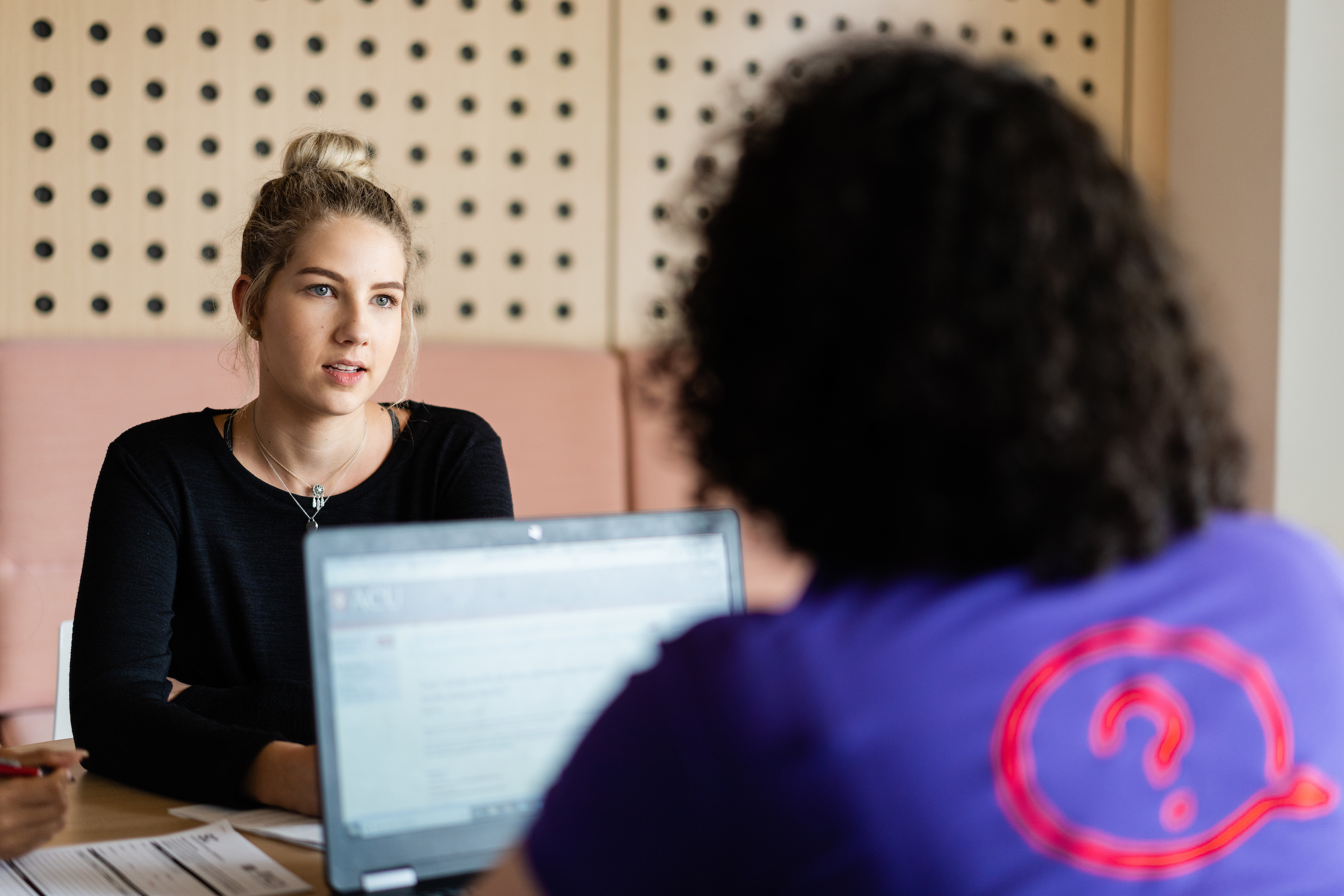  Student and an ACU representative talking