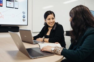  Students in a meeting room collaborating